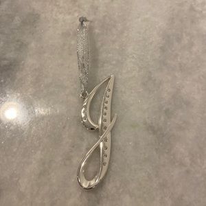 Harvey Lewis's letter J in cursive ornament.